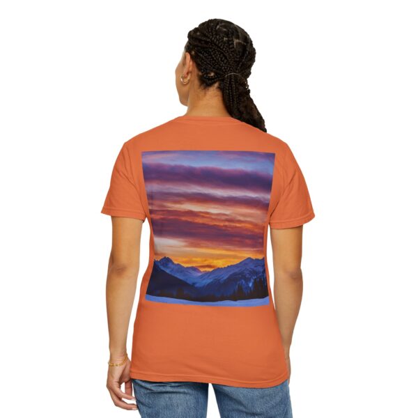 Woman wearing burnt orange Mountain Glow Horizon T-shirt while standing – back view