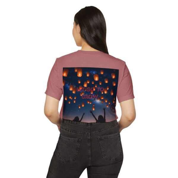 Woman wearing heather mauve Eco-Friendly Graphic T-Shirt while standing – back view