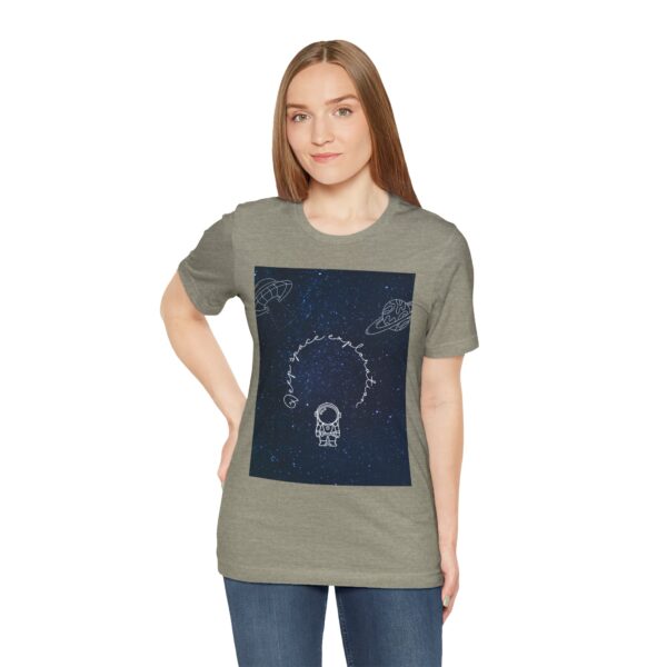 Woman wearing heather stone Stellar Eclipse T-shirt while standing – front view