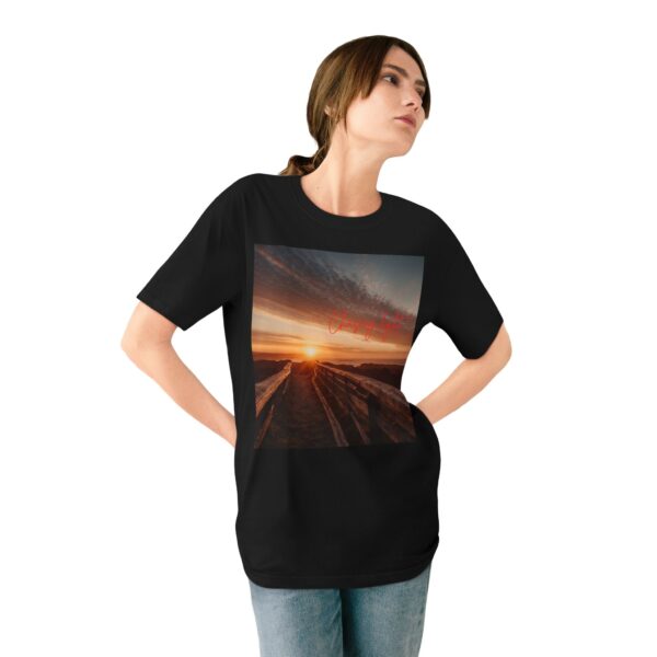 Woman wearing black Scenic Inspirational T-shirt while standing– front view