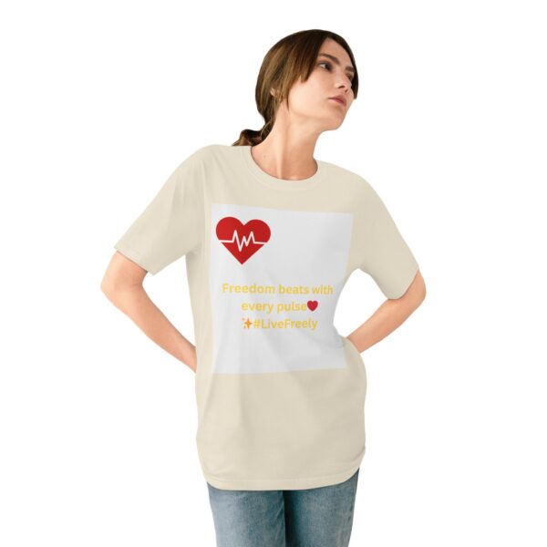 Woman wearing natural Heartbeat & Sunset Silhouette T-shirt while standing – front view
